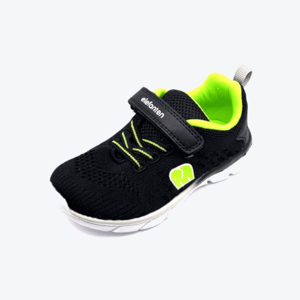 Das Titelbild präsentiert die Elefanten Klettschuhe Teja Tita in der Größe 26 aus einem dynamischen 30-Grad-Winkel, wobei die auffällige Farbkombination von Schwarz und Neongrün besonders zur Geltung kommt.
